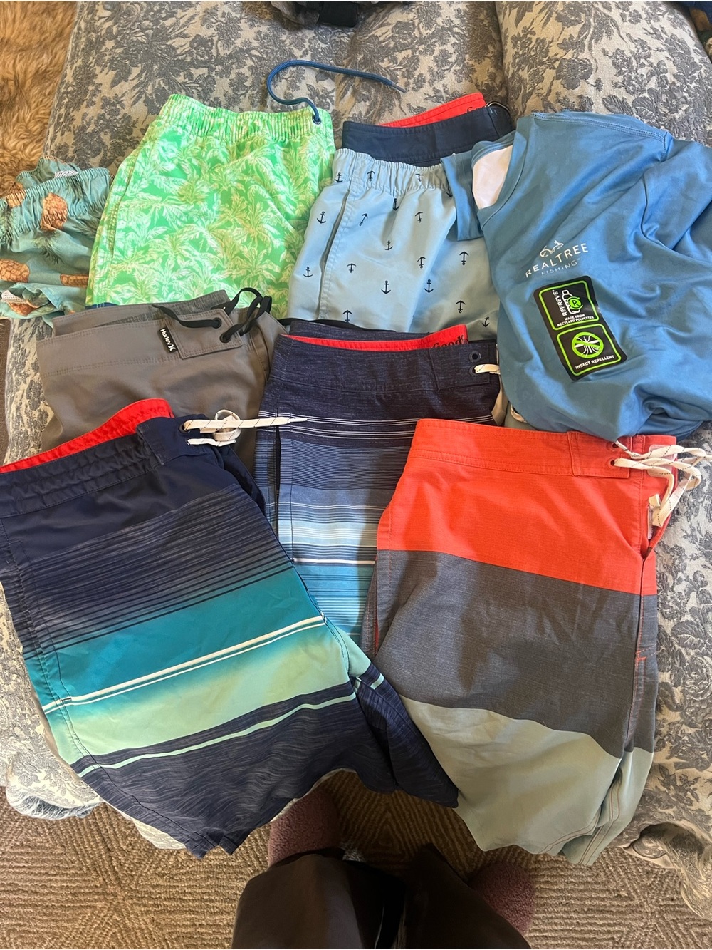 Lot of 9 swim trunks + rash guard
